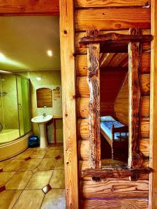 a bedroom with a bunk bed in a log cabin at Ранчо в Карпатах in Bukovel +82 photos