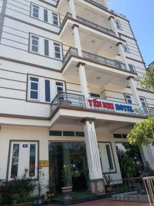 a building with a sign on the front of it at Yến Nhi Hotel VĐ- by BAY LUXURY in Quang Ninh +5 photos
