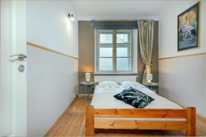 Posteľ alebo postele v izbe v ubytovaní Prime Location Apartment