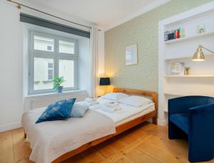 Posteľ alebo postele v izbe v ubytovaní Prime Location Apartment