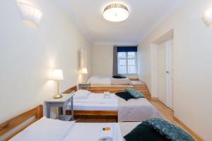 Posteľ alebo postele v izbe v ubytovaní Prime Location Apartment