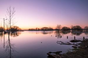 a view of a lake at sunset at Studio centre bourg in Saint-Mars-de-Coutais