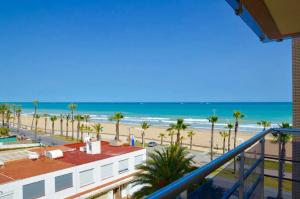 a view of the beach from the balcony of a condo at Apartamentos Deluxe Peñíscola in Peniscola