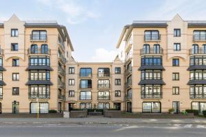 an exterior view of a large apartment building at Dauphin 0401 in Wenduine