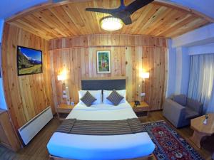 Postel nebo postele na pokoji v ubytování Hotel Phuntsho pelri