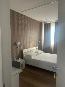 Posteľ alebo postele v izbe v ubytovaní Hotel Villa Ruggiero