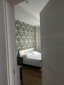 Posteľ alebo postele v izbe v ubytovaní Hotel Villa Ruggiero