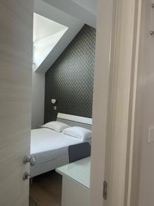 Posteľ alebo postele v izbe v ubytovaní Hotel Villa Ruggiero