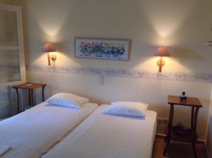 A bed or beds in a room at Villa Bouboule