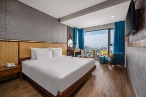 Giường trong phòng chung tại White Sand Boutique Hotel