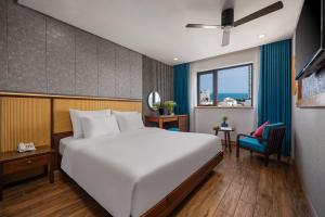 Giường trong phòng chung tại White Sand Boutique Hotel