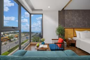 Giường trong phòng chung tại White Sand Boutique Hotel