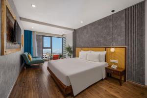 Giường trong phòng chung tại White Sand Boutique Hotel