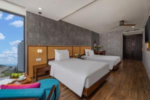 Giường trong phòng chung tại White Sand Boutique Hotel