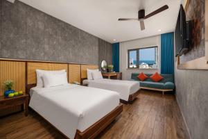 Giường trong phòng chung tại White Sand Boutique Hotel
