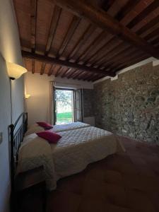 Postel nebo postele na pokoji v ubytování Relais La Pieve Vecchia + 37 fotografií