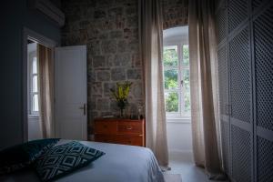Postel nebo postele na pokoji v ubytování Gardin Split Apartment and Suite
