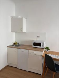 Kuchyňa alebo kuchynka v ubytovaní Hungaria Apartments