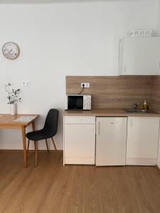 Kuchyňa alebo kuchynka v ubytovaní Hungaria Apartments