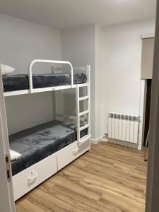 Postel nebo postele na pokoji v ubytování Albergue San Nicolás