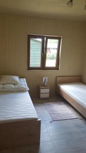 En eller flere senge i et værelse på Domki Lilia