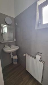 Kúpeľňa v ubytovaní Hungaria Apartments