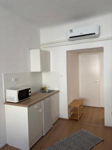 Kuchyňa alebo kuchynka v ubytovaní Hungaria Apartments