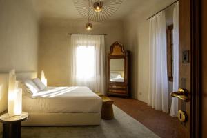Postel nebo postele na pokoji v ubytování Casa Ruffino - Wine Relais