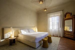 Postel nebo postele na pokoji v ubytování Casa Ruffino - Wine Relais