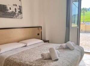 Postel nebo postele na pokoji v ubytování Vecchio Frantoio Villa Rosa
