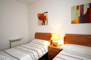 Postel nebo postele na pokoji v ubytování Villa Garnet by Rentalole