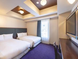 Ένα ή περισσότερα κρεβάτια σε δωμάτιο στο Hotel Wing International Select Ikebukuro +128 φωτογραφίες