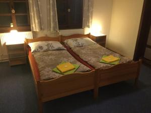 Ein Bett oder Betten in einem Zimmer der Unterkunft Penzion Ida