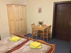 Ein Bett oder Betten in einem Zimmer der Unterkunft Penzion Ida