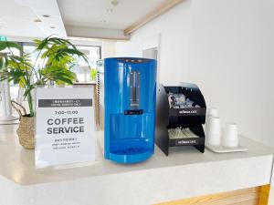 a blue container sitting on a counter next to a box at Miyazaki Mango Hotel - Vacation STAY 58252v in Miyazaki