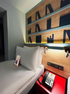Postel nebo postele na pokoji v ubytování ibis Styles Ankara