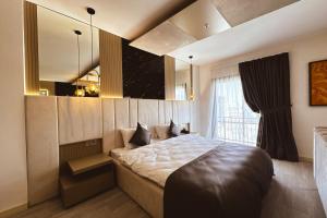 a bedroom with a large bed and a window at Dorana Art Hotel in Kyrenia