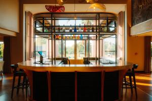 a bar in a room with a large window at Emerald Resort & Casino in Vanderbijlpark +37 photos