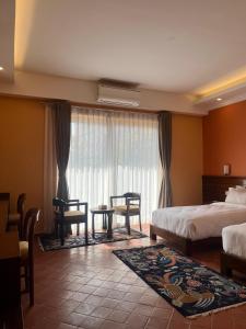 מיטה או מיטות בחדר ב-Hotel Dolmaling