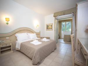 Postel nebo postele na pokoji v ubytování Toscana Wellness Resort