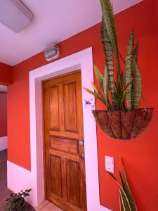 a room with a door and a plant at The Pink Villa - Holidays in Madeira Island in Caniço +33 photos