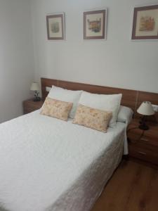 Ένα ή περισσότερα κρεβάτια σε δωμάτιο στο Apartamento Clarin
