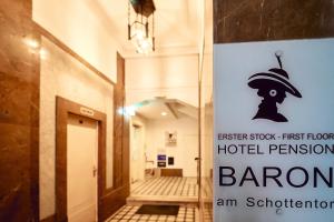 a sign for the first floor of a building at Hotel Pension Baron am Schottentor in Vienna