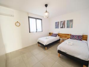 Katil atau katil-katil dalam bilik di Appartement CATALINA - Double terrasse - WIFI - Clim - PORTICCIO