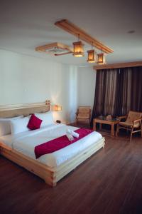 a bedroom with a large bed in a room at Kesar Palace Hotel & Restaurant, Skardu in Skardu +51 photos