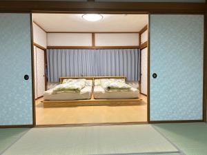 Letto o letti in una camera di 民宿NaMi