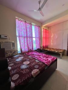 Voodi või voodid majutusasutuse Radha ballabh guest house toas