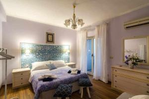 Postel nebo postele na pokoji v ubytování Mediterranean Charm villa con piscina al mare