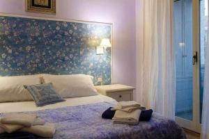 Postel nebo postele na pokoji v ubytování Mediterranean Charm villa con piscina al mare
