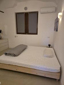 a bed in a room with a window at LakeView LakeComo, CIPRESSO 2, 4Seasons, Terrace, 30m to Lake! by STAYHERE-LAKECOMO in Acquaseria